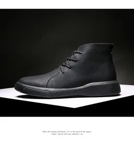 Side view of black genuine leather men's high-top work boots with textured finish