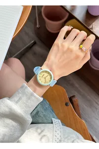 Minimalist pastel blue quartz watch for women worn on wrist in a lifestyle setting