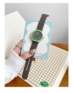Close-up of green octagonal student quartz watch with cartoon dial design