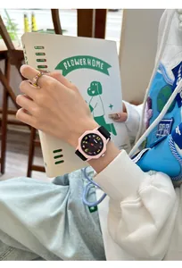 Detail view of a pink octagonal dopamine student watch with colorful dial markers.