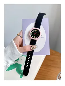 Detailed view of a pink octagonal student quartz watch with a durable black silicone strap.