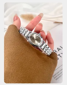 Close-up view of an elegant oval silver steel band quartz watch for women by Gedi