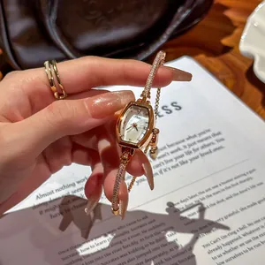 Elegant rose gold women's watch featuring a crystal-encrusted band and unique hexagonal face