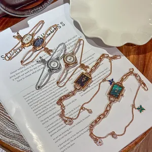 Elegant women's rhinestone alloy bracelet watches with various dial colors and designs