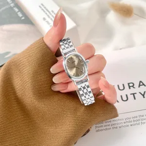 Elegant retro oval women's quartz watch with silver steel band and champagne dial