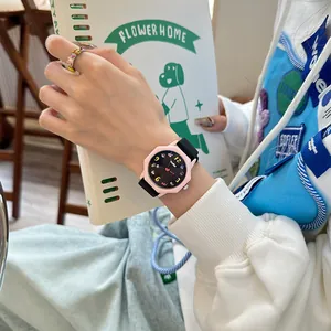 Stylish student analog watch featuring a pink octagonal case and colorful cartoon dial