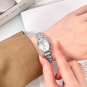 Minimalist vintage Gedi oval silver steel band quartz watch for women shown on a model wrist
