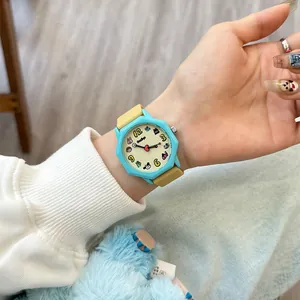 Vibrant dopamine style student watch with cute cartoon dial and octagonal blue case.