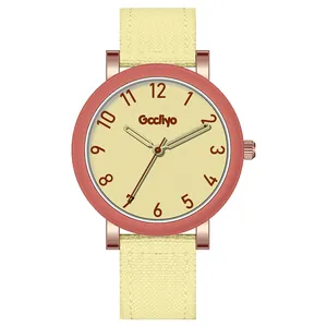 Minimalist women's quartz watch with a pink bezel and light yellow fabric strap
