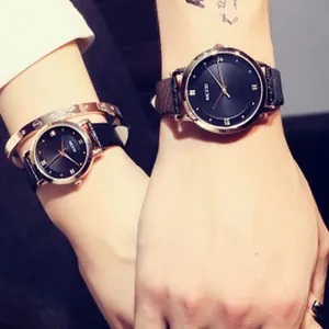 Close-up detail of stylish GUOU women's quartz watch featuring a sleek black leather strap