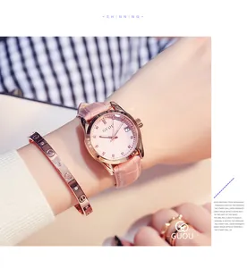 Close-up of GUOU women's quartz watch with pink leather strap and rhinestone dial
