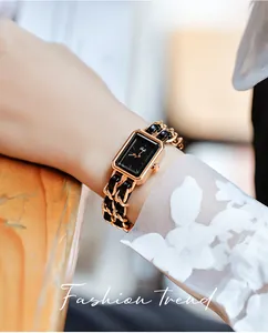 Close-up of Gedi women's watch with rectangular black dial and braided chain strap