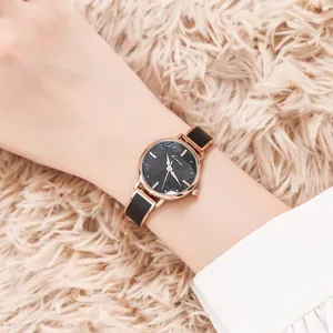 Elegant Kimio women's watch with starry sky dial and rose gold case on a soft background