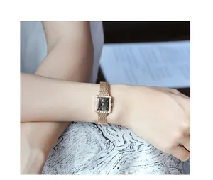 Elegant gold square watch for women with mesh band and sparkling diamond bezel detail