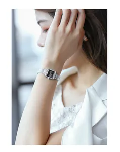 Elegant women's square quartz watch with a rhinestone bezel and silver mesh strap