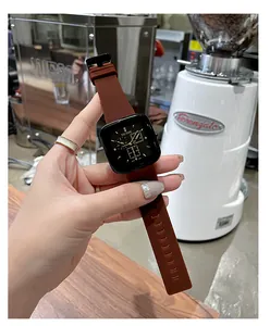 Detailed view of TICTOC square fashion watch with brown silicone strap and black dial.