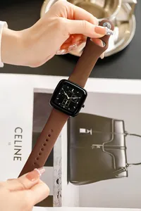 Detailed view of a brown silicone strap watch featuring a square black TICTOC dial