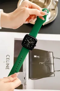 Detail view of fashion green silicone watch with black square dial and TICTOC logo