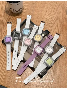 Collection of stylish square quartz watches with colorful silicone straps on a wooden table.