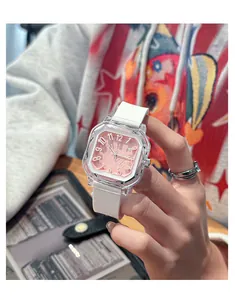Detail view of pink square dial quartz watch with white silicone strap and transparent case