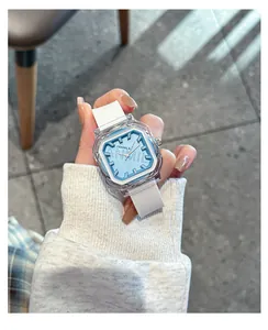 Close-up of square blue dial quartz watch with transparent case and white strap