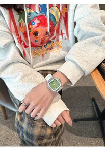 Close-up detail of Panmila women's square watch featuring a vibrant green dial and white strap.