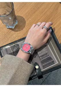Close-up of GEDI women's watch with vibrant pink dial and silver steel strap.