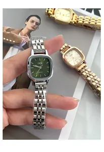 Detailed view of GEDI square quartz watch with a green dial and silver steel strap