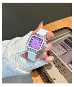 Macro view of purple square quartz watch with transparent case and white silicone strap