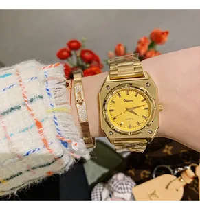 Detail view of Dinimi gold octagonal women's watch with yellow dial and bangle