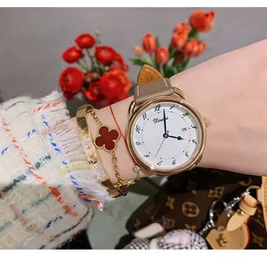 Detail of Dinimi minimalist ladies' quartz watch with calendar and round dial