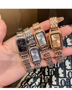 Detailed view of four Dinimi steel strap quartz watches in gold, silver and rose gold.
