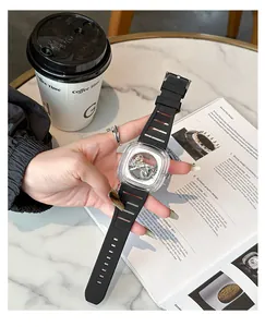 Detail shot of GUOU square mechanical watch with transparent case and black silicone strap.