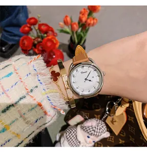 Elegant Dinimi women's quartz watch featuring a white dial, calendar and leather strap
