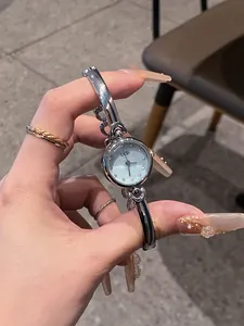 Elegant GEDI silver bangle watch featuring a minimalist round dial and polished finish
