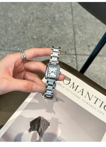 Close-up of a silver GUOU vintage rectangular watch featuring a classic steel strap