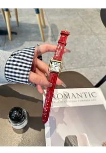 Close-up view of a GUOU square gold watch featuring a vibrant red crocodile leather strap.