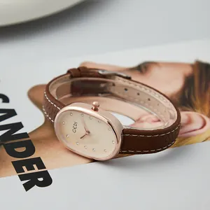 Elegante reloj de cuarzo GEDI para mujer con caja ovalada de oro rosa y correa de cuero.