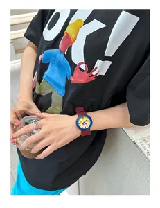 Close-up of cute cartoon star watch with blue case and red silicone strap