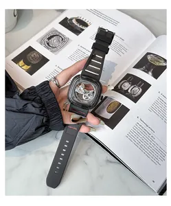 Detail of GUOU black mechanical watch with transparent square dial and silicone strap