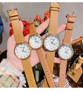 Detailed view of Dinimi women's quartz watch with shell texture dial and date window