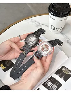 Close-up of GUOU women's mechanical watch with transparent square case and silicone strap.