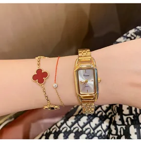 Close-up detail of Dinimi elegant gold steel band quartz watch for women with rectangular face