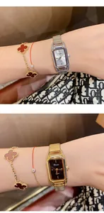 Detailed view of Dimini retro square quartz watches in silver and gold on a lady's wrist