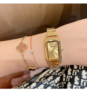 Close-up of Dinimi gold-tone women's quartz watch with elegant rectangular dial