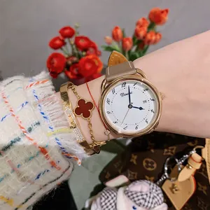 Elegant ladies round quartz watch with date window, shell dial and brown leather strap