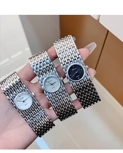 Detailed macro shot of three Dinimi vintage-style quartz bracelet watches with silver bands