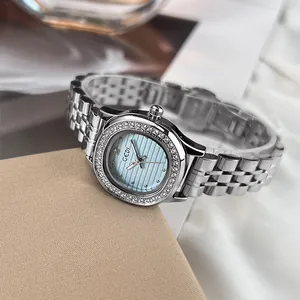 Montre à quartz élégante en acier argenté avec cadran bleu clair et lunette en strass