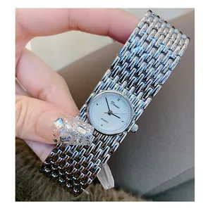 Elegant Dinimi silver bangle watch for women with textured dial close-up view