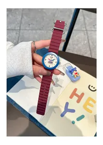Detail shot of GCCLIYO silicone watch with burgundy strap and blue bezel bezel.